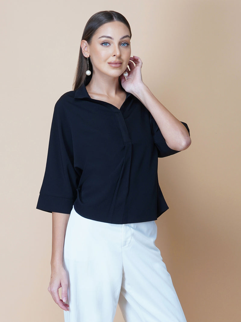 Black oversized women's shirt is a loose-fitting garment designed for a comfortable and relaxed fit. This type of shirt typically features a classic button-up front and a pointed collar, as well as long sleeves that can be rolled up for a more casual look.  The black color adds a touch of sophistication to the overall appearance of the shirt, making it suitable for a variety of occasions. It is made from soft, breathable fabric that drapes gently over the body, providing ample room for movement.