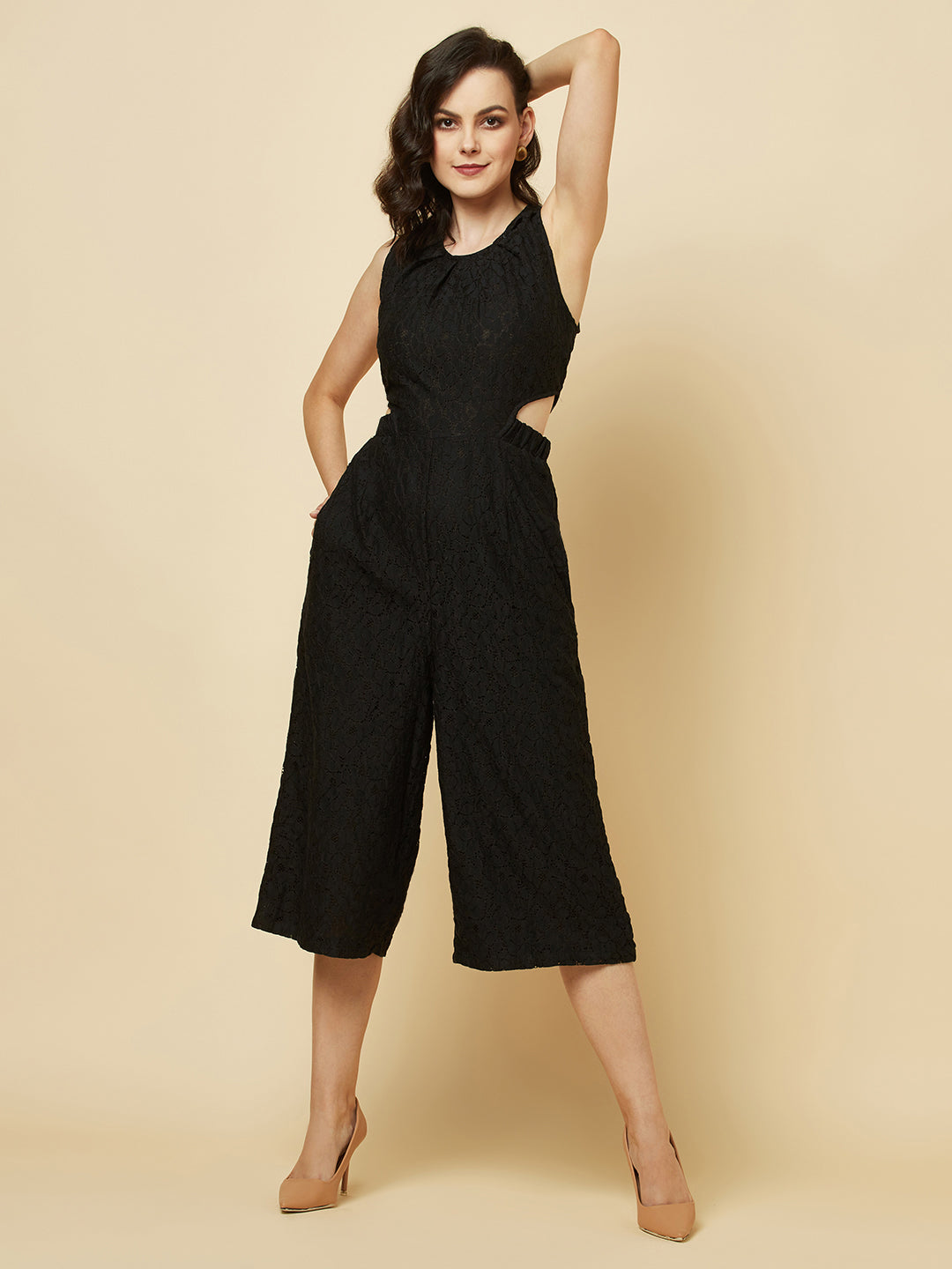 The Black Floral Mesh Side Waist Cut Jumpsuit for Women is a stylish and elegant outfit that features a vibrant black floral pattern and mesh detailing on the sides. This jumpsuit for women is designed to accentuate the waistline with a flattering cut, making it a great choice for any formal occasion or dressy event. It is comfortable to wear and made from high-quality materials, ensuring both style and comfort.