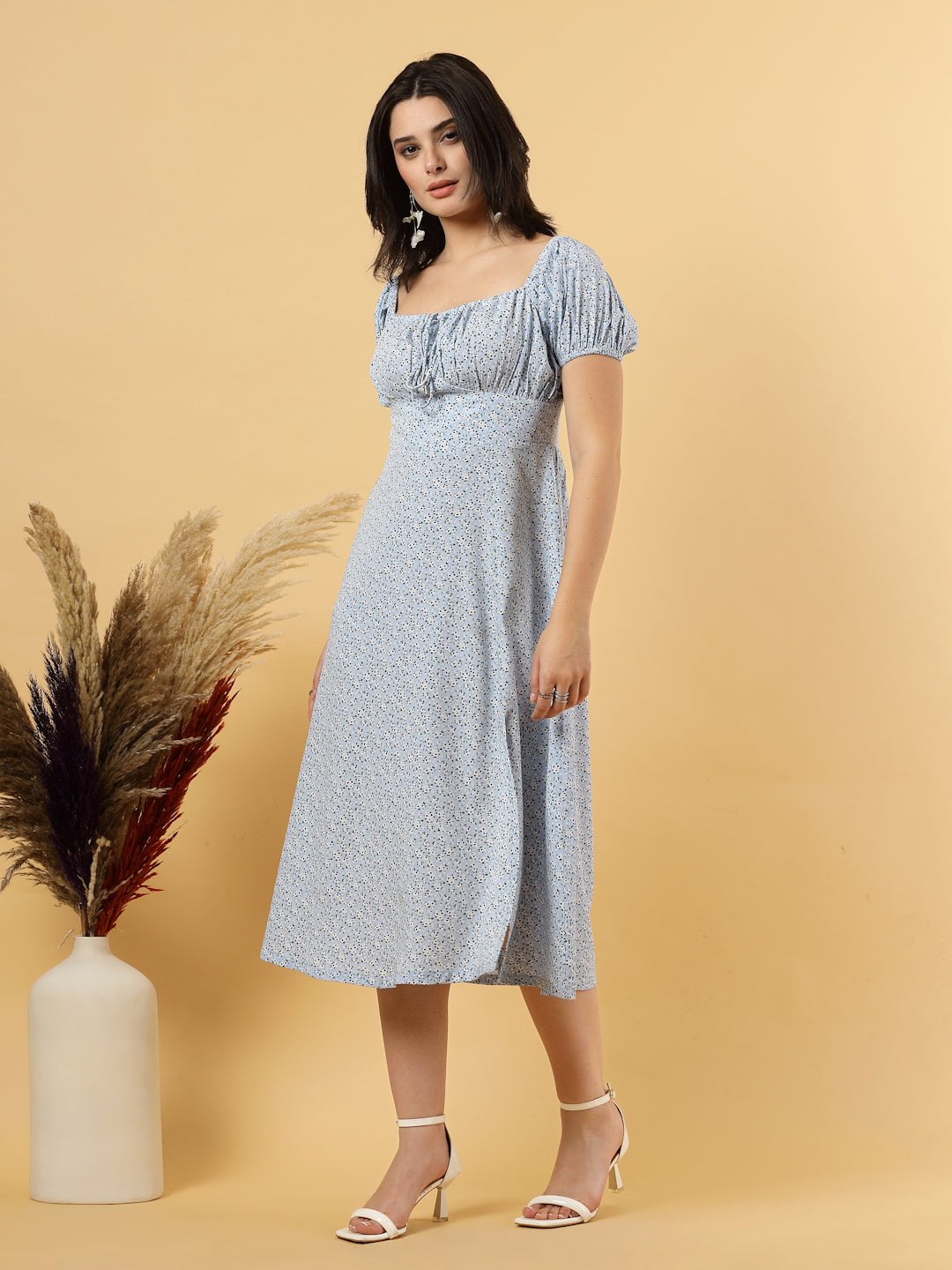 Sunshine in a dress! This flirty A-Line midi boasts a ruched bust, square neck, empire waist, and a flattering front slit – all adorned with gorgeous summer prints. 
Zip Closure at back.