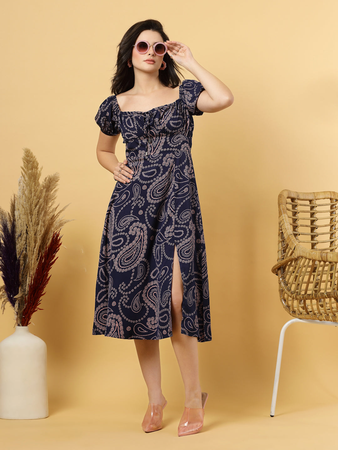 Sunshine in a dress! This flirty A-Line midi boasts a ruched bust, square neck, empire waist, and a flattering front slit – all adorned with gorgeous summer prints. 
Zip Closure at back.