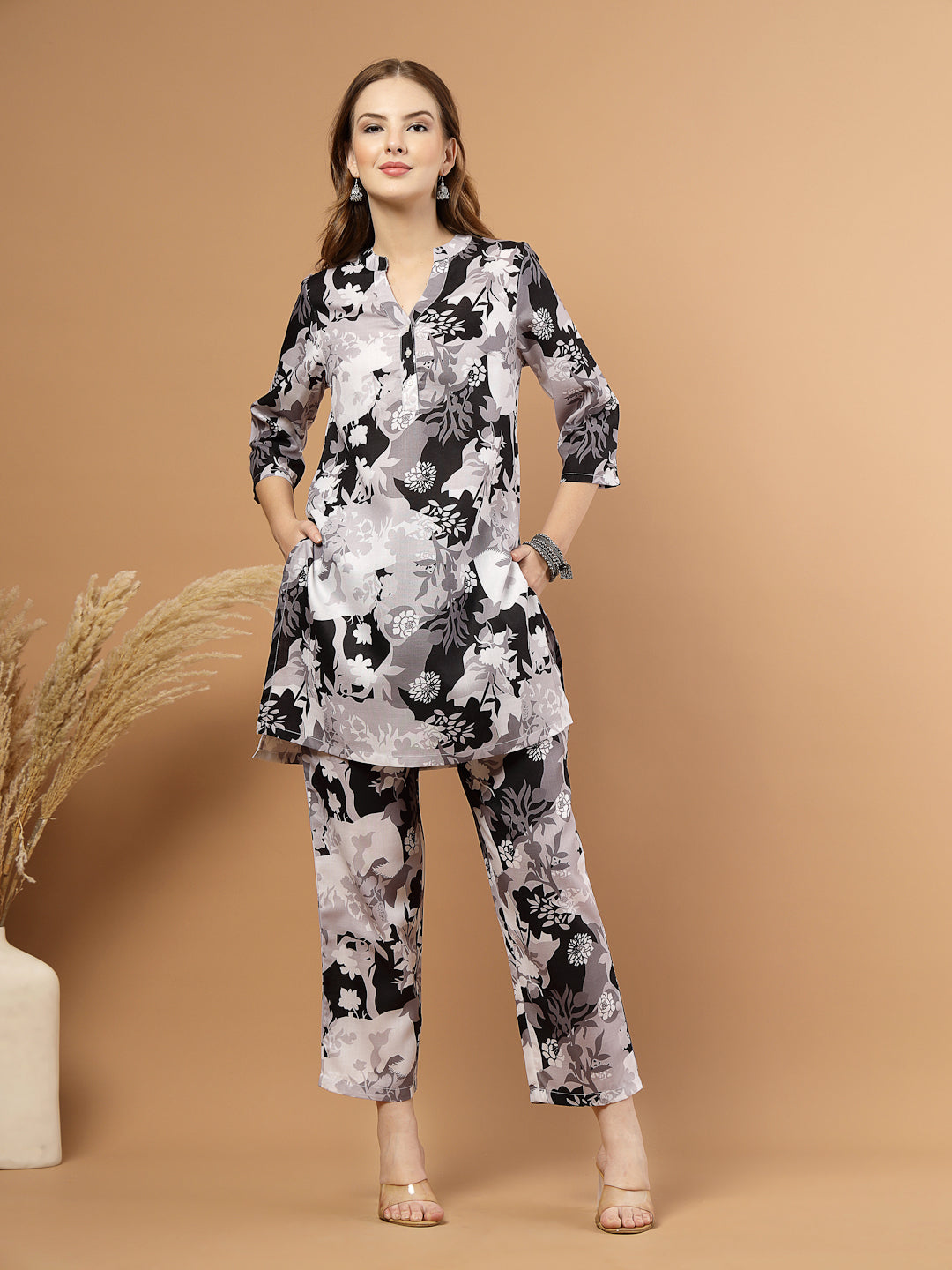 Black and white tropical printed kurta with matching bottoms, featuring soft breathable fabric and coordinated design for casual or festive wear.