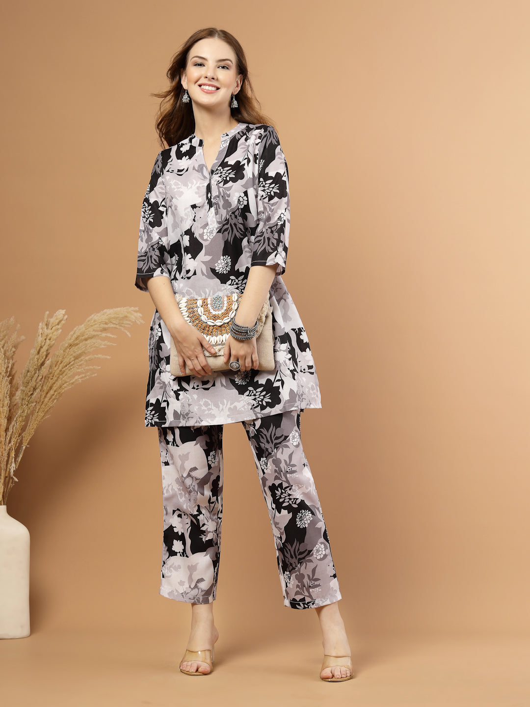 Black and white tropical printed kurta with matching bottoms, featuring soft breathable fabric and coordinated design for casual or festive wear.