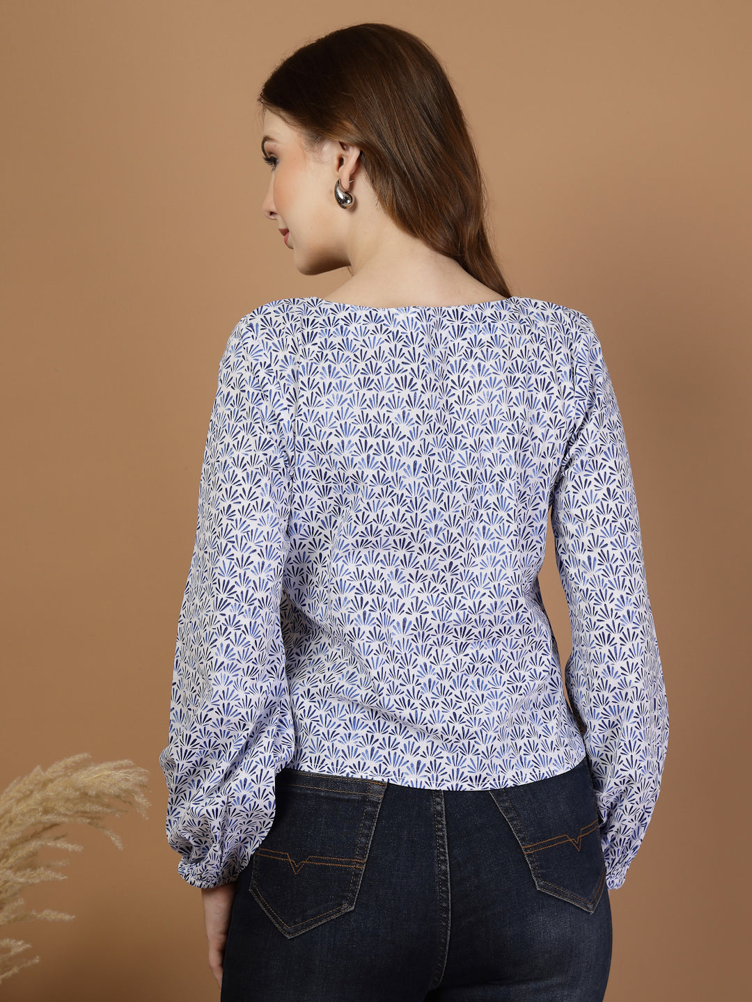 Blue long sleeve blouse top for women with keyhole neckline, printed cotton fabric, and elasticated sleeve ends for a comfortable fit.