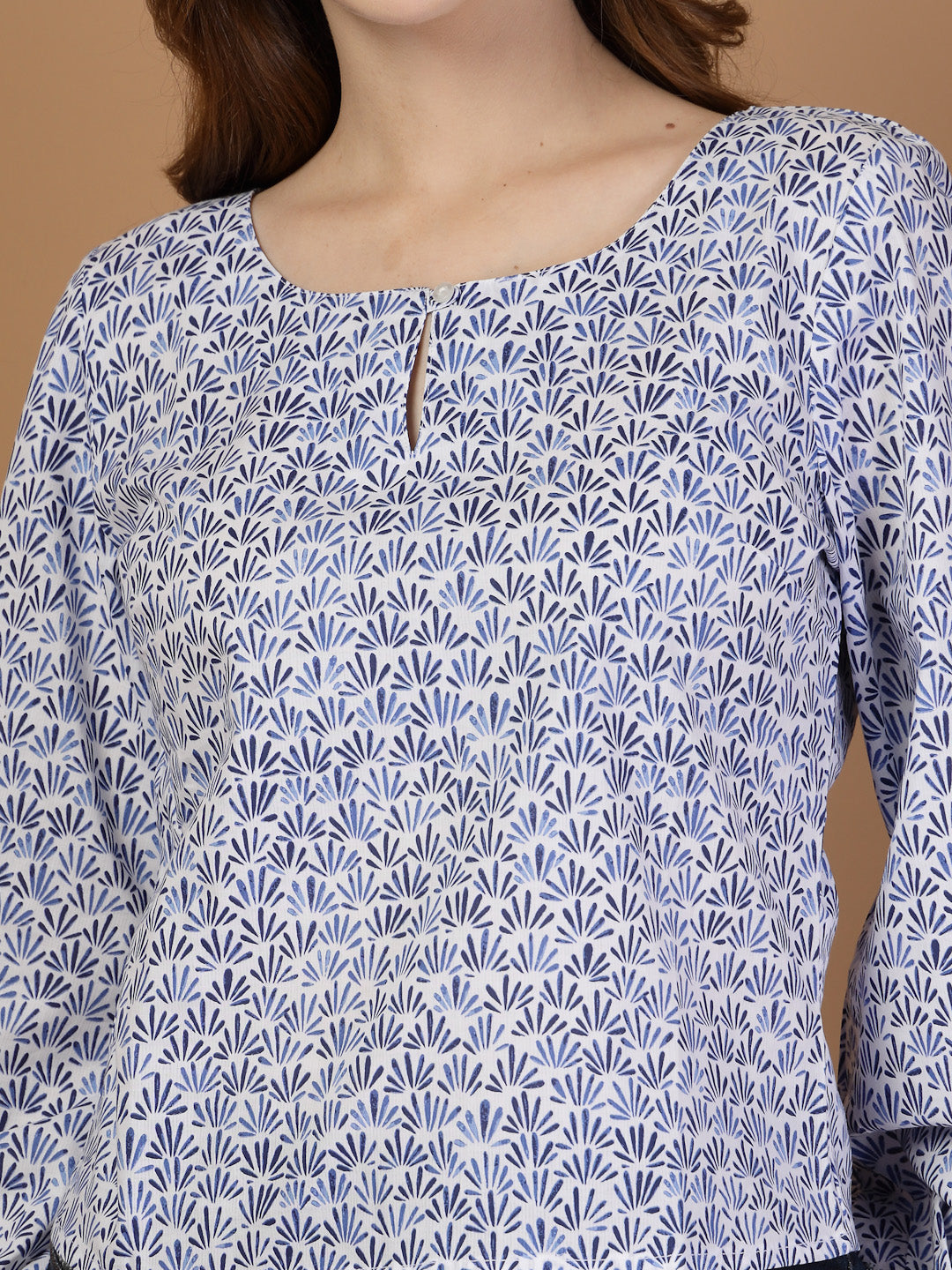 Blue long sleeve blouse top for women with keyhole neckline, printed cotton fabric, and elasticated sleeve ends for a comfortable fit.