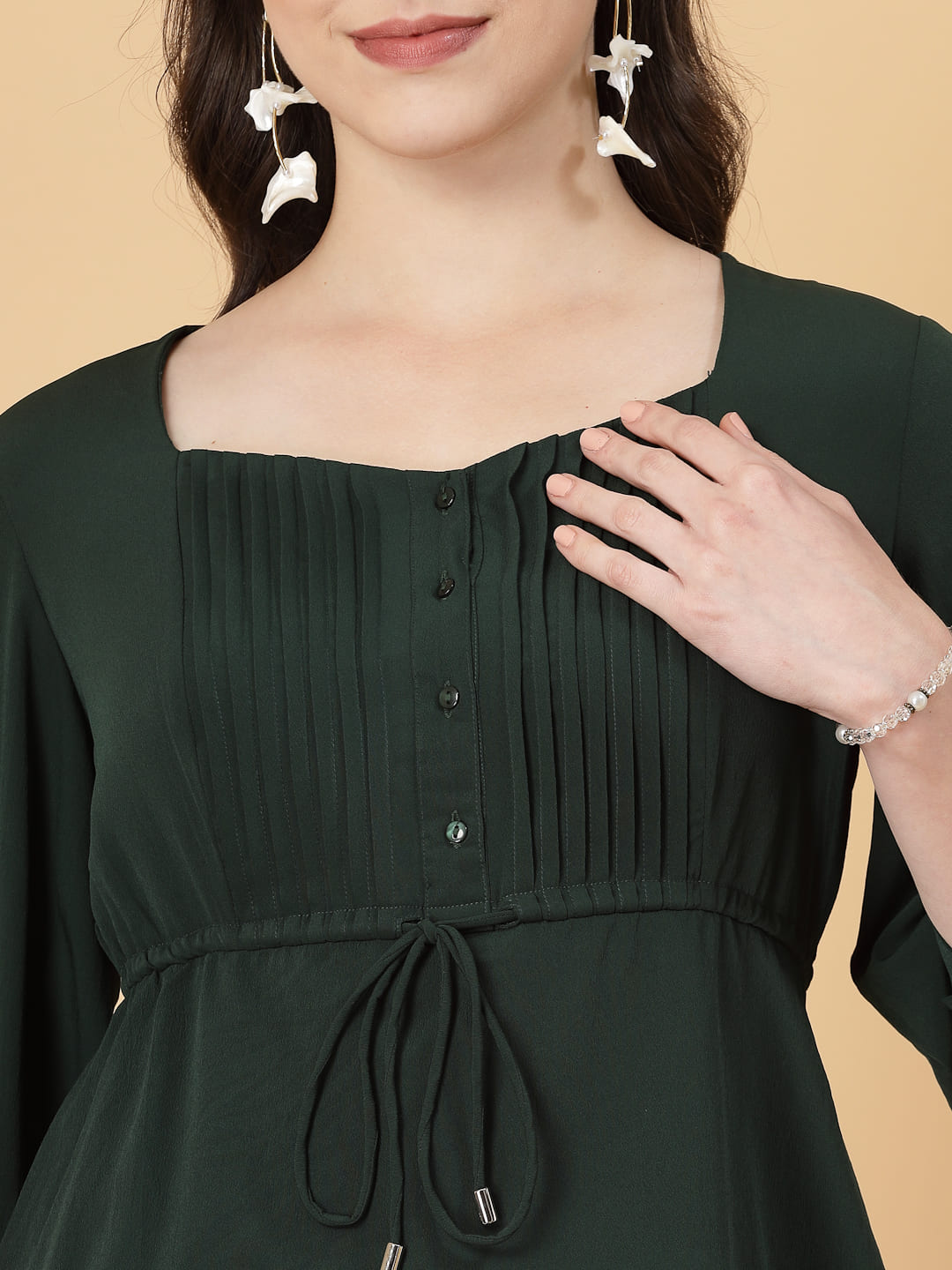 Effortlessly chic. Work-ready. This solid blouse with pintuck detail adds a touch of polish to your Formal outfit. Cuffed sleeves, drawstring waist, and pintuck charm. Dress it up or down this blouse does it all.
Solid color, pintuck detail, and a touch of cinch. Your new Formal blouse For Work.