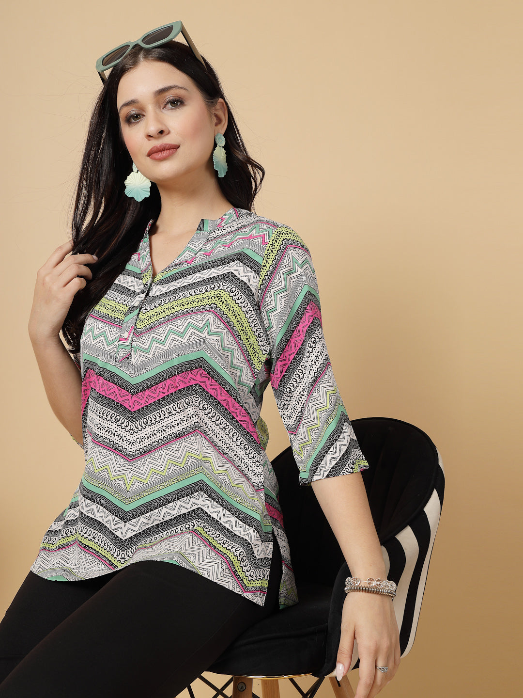 A modern take on a classic. This hip-length Printed kurta top offers a band collar, button-front, and a breezy, loose silhouette. Perfect, for office & casual outings.
Dress it up or down for any occasion.