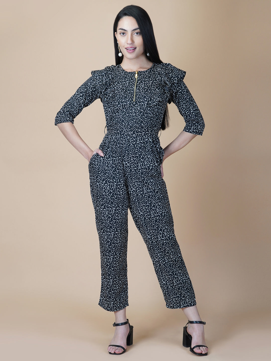This black and white printed women jumpsuit is perfect for a stylish and chic look. The bow tie belt adds a touch of femininity, while the side ruffles add a playful element. It's made from a soft and lightweight material that's perfect for wearing all day long.