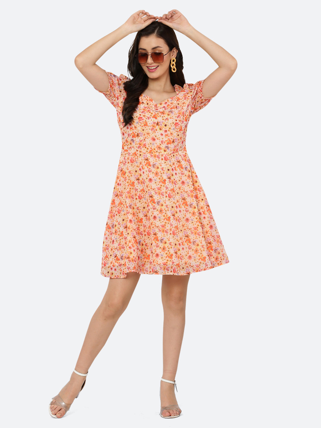 This dress features a circular hemline that adds a playful, flirty feel to the overall design. The ruched neckline and smocked sleeves add texture and dimension to the dress, while also providing a snug and comfortable fit. Perfect for summer days and breezy evenings, this dress is versatile and easy to wear, making it a must-have in your wardrobe.