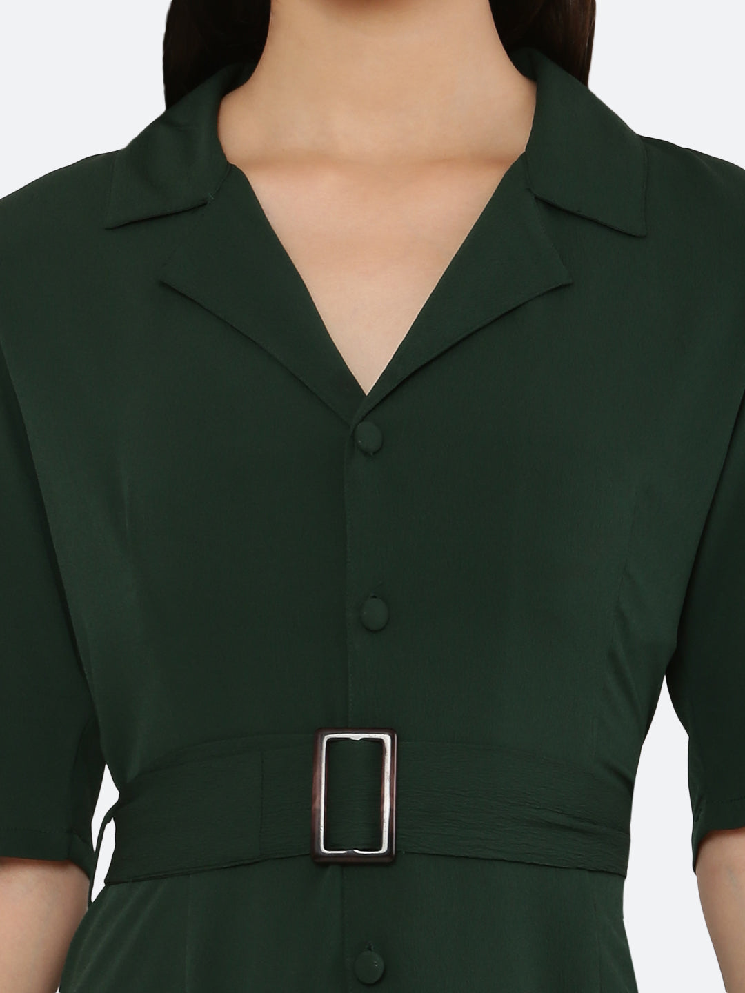 This short dress is the perfect combination of sophistication and style. The tailored collar adds a touch of elegance while the belt cinches in at the waist to create a flattering silhouette. The solid color makes it versatile and easy to pair with various accessories. Wear it to a summer barbecue or dress it up for a night out on the town. This dress is a must-have for any fashionista's wardrobe.