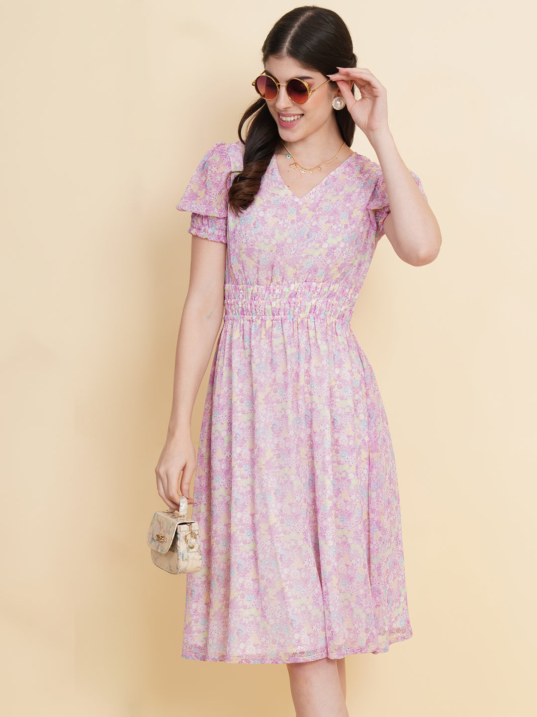 Slay the season in this refreshing purple print ruched waist dress for women. Tailored in a flowy silhouette, the dress features an all over floral print with attached lining and ruched detail on the waist.