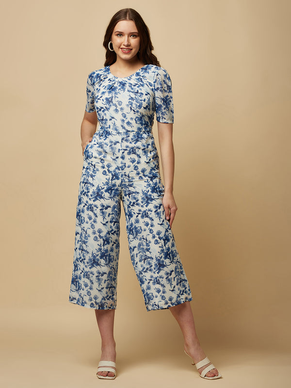 Introducing our stunning Blue Printed Women Jumpsuit With Back Waist Cut and Draw String, the perfect addition to your wardrobe for a stylish and comfortable look.  Crafted from high-quality materials, this jumpsuit is both soft and durable, making it perfect for all-day wear. The back waist cut adds a touch of elegance to the design, while the drawstring ensures a perfect fit that flatters your figure.