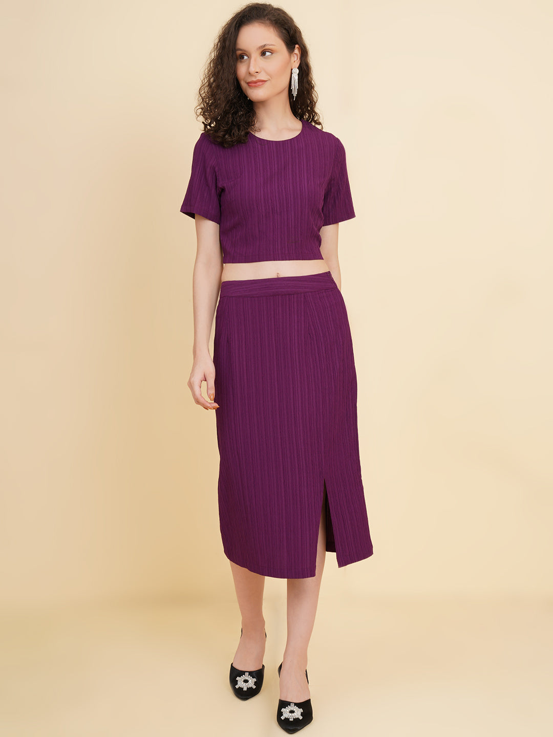 Unleash your inner fashionista with our stunning purple stretchable co-ord set!  Featuring a trendy crop top and a sleek straight skirt.   Colour: Purple Material: Polyester Neck: Round with Keyhole at back Sleeve: Short Top Closure: Button Skirt Closure: Zip