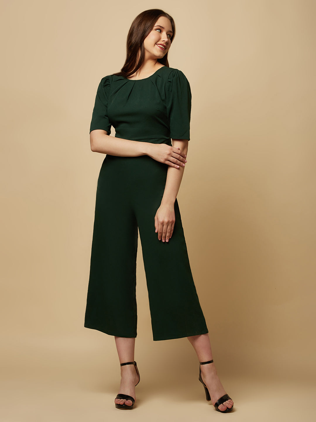 Introducing our stunning Green solid Women Jumpsuit With Back Waist Cut and Draw String, the perfect addition to your wardrobe for a stylish and comfortable look. This jumpsuit features a unique pattern that is sure to turn heads and make you stand out from the crowd.  Crafted from high-quality materials, this jumpsuit is both soft and durable, making it perfect for all-day wear.