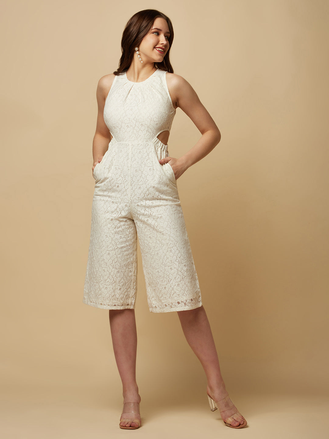 The Off white Floral Mesh Side Waist Cut Women Jumpsuit is a stylish and elegant outfit that features a vibrant off white floral pattern and mesh detailing on the sides. The jumpsuit is designed to accentuate the waistline with a flattering cut, making it a great choice for any formal occasion or dressy event. It is comfortable to wear and made from high-quality materials, ensuring both style and comfort.