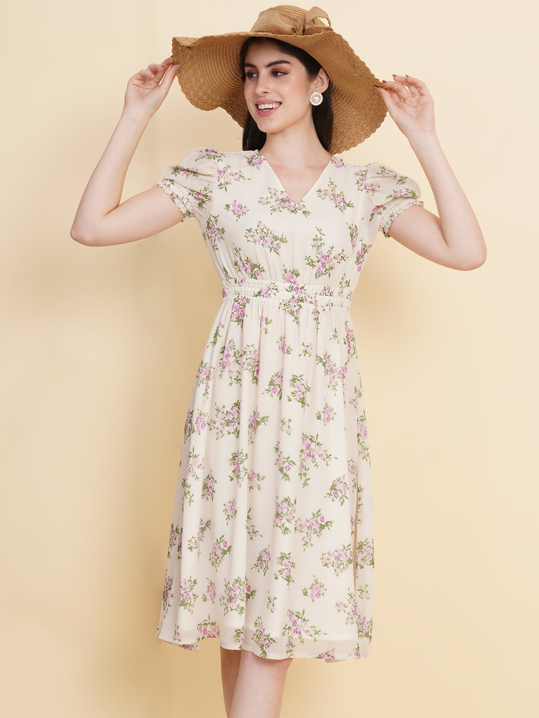 Slay the season in this refreshing cream print ruched waist dress for women. Tailored in a flowy silhouette, the dress features a floral print with attached lining and ruched detail on the waist.  Style Tip: Enhance your look with strappy sandals and a white sling bag.