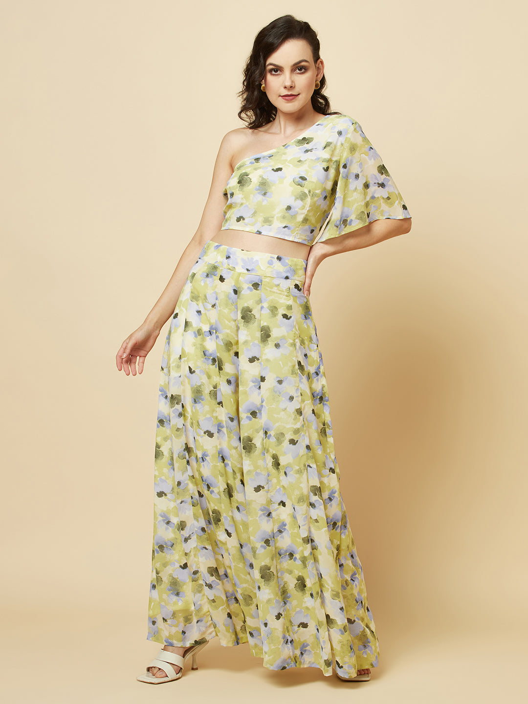 Green floral printed palazzo with one shoulder crop top co-ords for women is a stylish and comfortable outfit choice. The palazzo pants feature a wide-leg cut, providing ease of movement and comfort. The green floral print adds a pop of color and a touch of femininity to the outfit. The one-shoulder crop top is a trendy and flattering choice, showing off the shoulders and adding a touch of elegance to the look. The co-ord set is perfect for a variety of occasions, from casual outings to dressy events. 