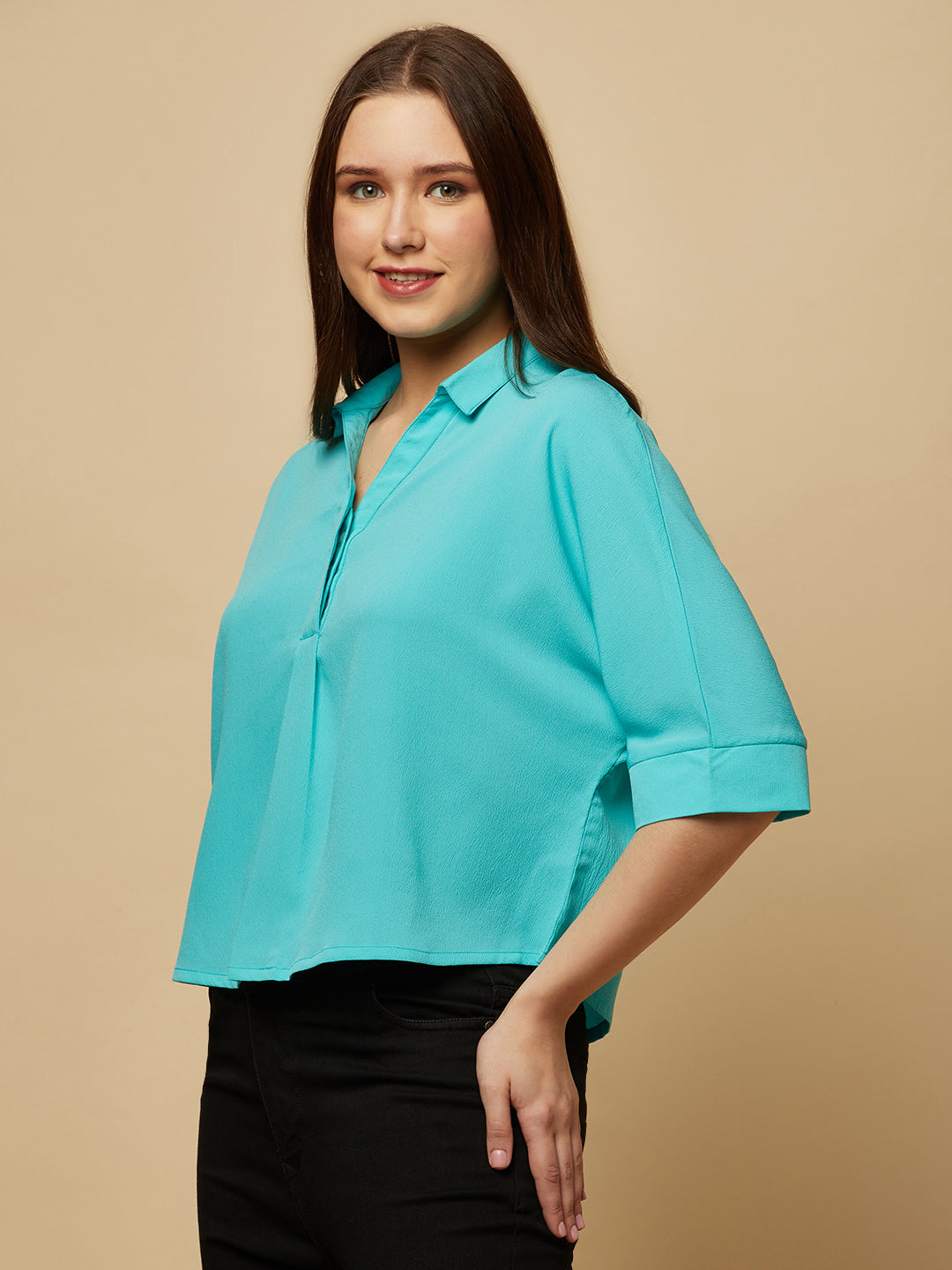 Turquoise Color Over Size Shirt for Women! This vibrant and eye-catching top is the perfect choice for fashion-forward women who want to stand out from the crowd. With its bold turquoise hue and oversized fit, it's the perfect combination of comfort and style. Whether you're dressing up for a night out or keeping it casual for a day out with friends, this shirt is sure to become your new go-to.