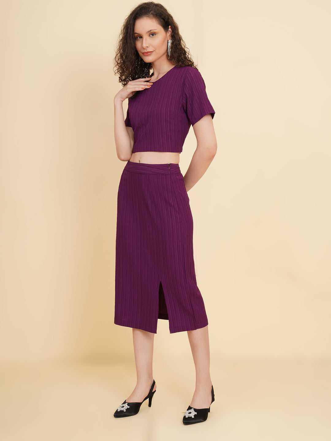 Unleash your inner fashionista with our stunning purple stretchable co-ord set!  Featuring a trendy crop top and a sleek straight skirt.   Colour: Purple Material: Polyester Neck: Round with Keyhole at back Sleeve: Short Top Closure: Button Skirt Closure: Zip