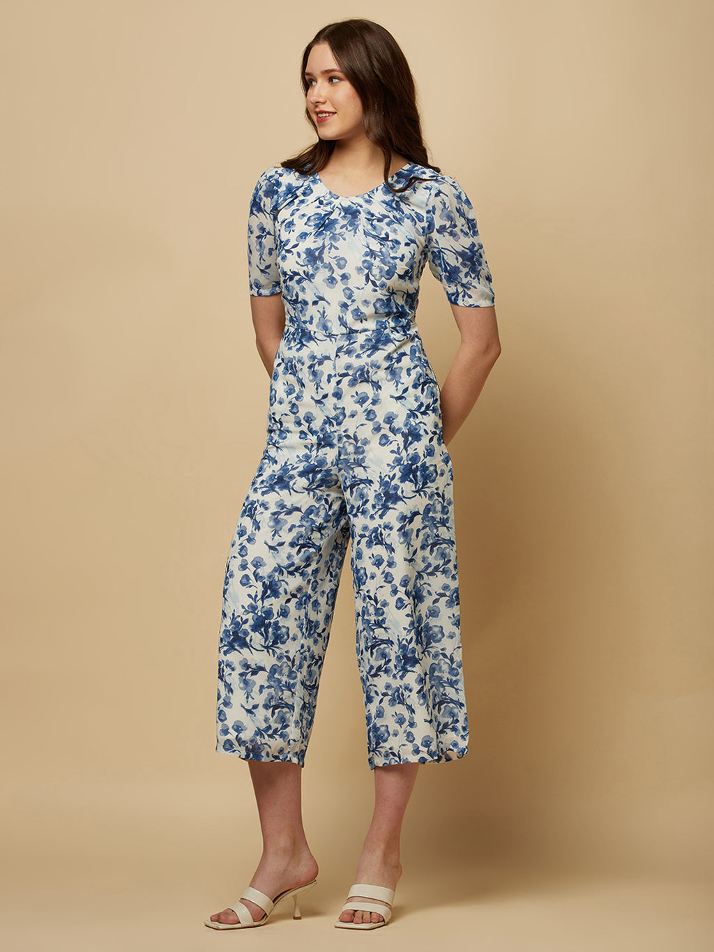 Introducing our stunning Blue Printed Women Jumpsuit With Back Waist Cut and Draw String, the perfect addition to your wardrobe for a stylish and comfortable look.  Crafted from high-quality materials, this jumpsuit is both soft and durable, making it perfect for all-day wear. The back waist cut adds a touch of elegance to the design, while the drawstring ensures a perfect fit that flatters your figure.
