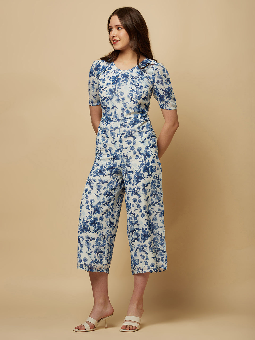 Introducing our stunning Blue Printed Women Jumpsuit With Back Waist Cut and Draw String, the perfect addition to your wardrobe for a stylish and comfortable look.  Crafted from high-quality materials, this jumpsuit is both soft and durable, making it perfect for all-day wear. The back waist cut adds a touch of elegance to the design, while the drawstring ensures a perfect fit that flatters your figure.