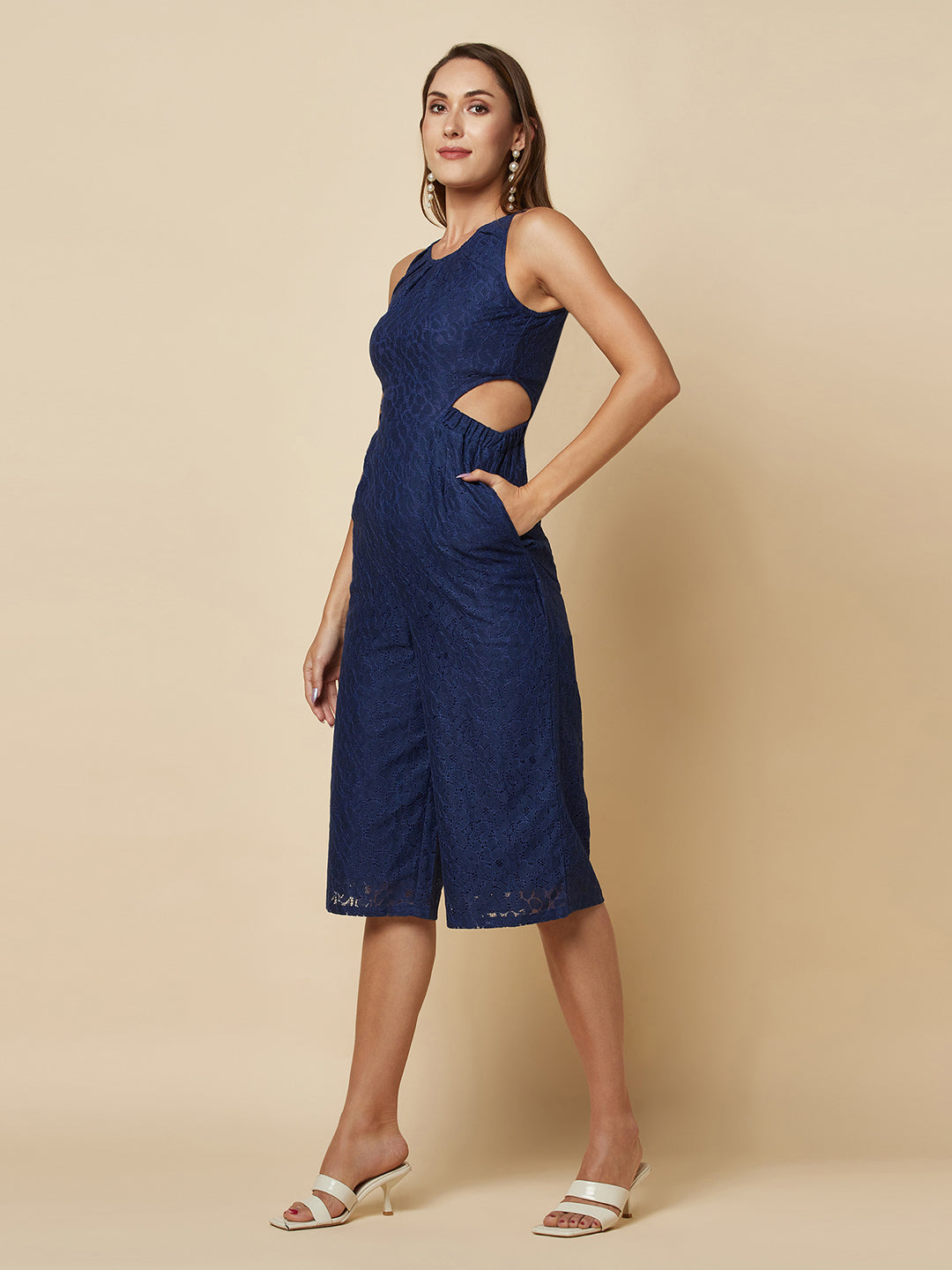 The blue Floral Mesh Side Waist Cut Jumpsuit for Women is a stylish and elegant outfit that features a vibrant blue floral pattern and mesh detailing on the sides. This women jumpsuit is designed to accentuate the waistline with a flattering cut, making it a great choice for any formal occasion or dressy event. This jumpsuit for women is comfortable to wear and made from high-quality materials, ensuring both style and comfort.