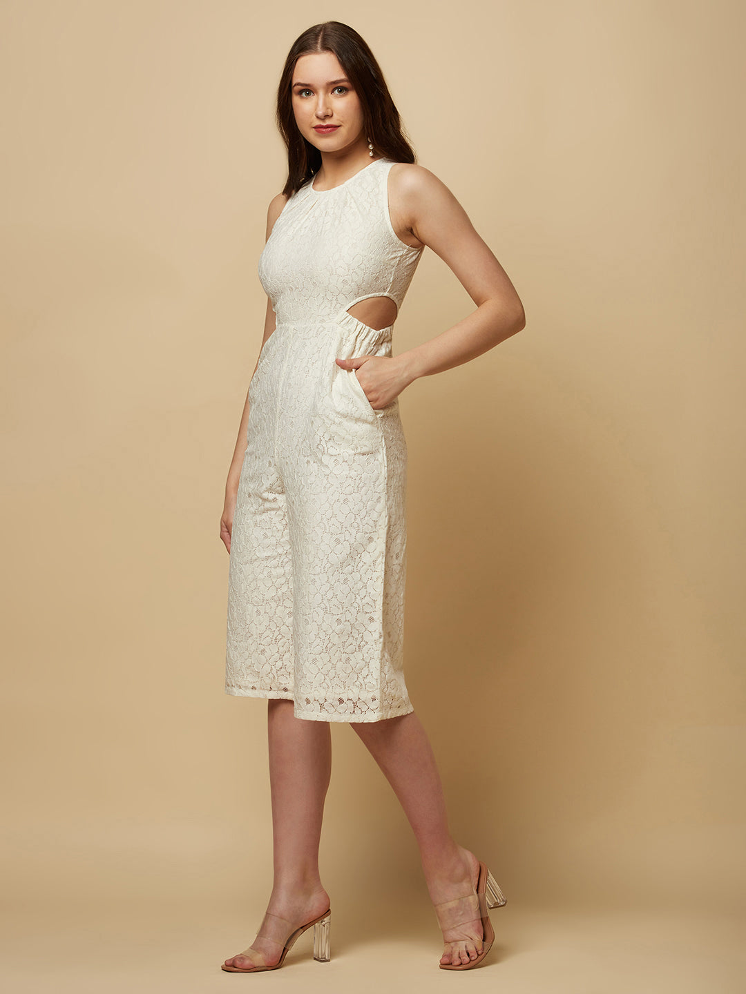 The Off white Floral Mesh Side Waist Cut Women Jumpsuit is a stylish and elegant outfit that features a vibrant off white floral pattern and mesh detailing on the sides. The jumpsuit is designed to accentuate the waistline with a flattering cut, making it a great choice for any formal occasion or dressy event. It is comfortable to wear and made from high-quality materials, ensuring both style and comfort.