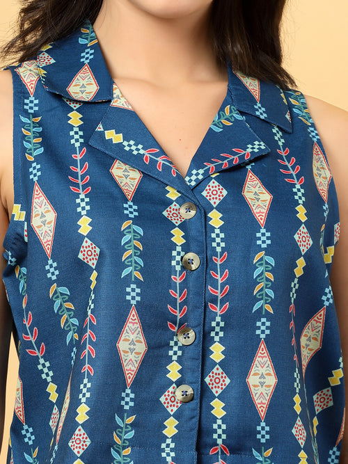 Elevate your ethnic style with this chic 2-piece co-ordinate set for women. The sleeveless top features a beautiful ethnic print with a tailored collar neck and a front button closure for a polished look. Paired with wide-leg pants designed with an elasticated waist, front pleats, and two handy side pockets—this set combines comfort with contemporary flair. Perfect for festive outings or casual gatherings.
