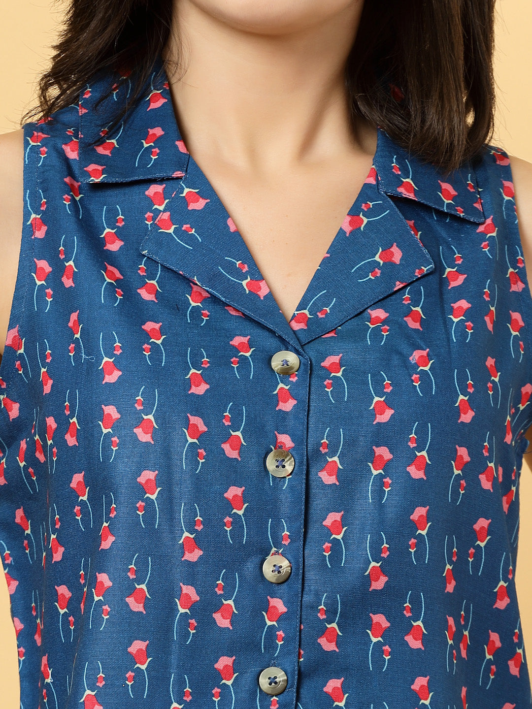 Elevate your ethnic style with this chic 2-piece co-ordinate set for women. The sleeveless top features a beautiful ethnic print with a tailored collar neck and a front button closure for a polished look. Paired with wide-leg pants designed with an elasticated waist, front pleats, and two handy side pockets—this set combines comfort with contemporary flair. Perfect for festive outings or casual gatherings.