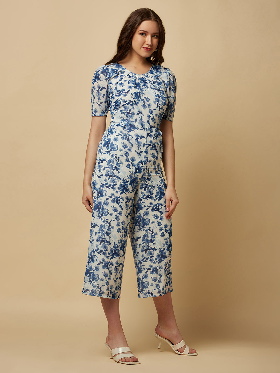 Introducing our stunning Blue Printed Women Jumpsuit With Back Waist Cut and Draw String, the perfect addition to your wardrobe for a stylish and comfortable look.  Crafted from high-quality materials, this jumpsuit is both soft and durable, making it perfect for all-day wear. The back waist cut adds a touch of elegance to the design, while the drawstring ensures a perfect fit that flatters your figure.