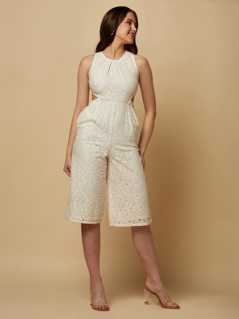 The Off white Floral Mesh Side Waist Cut Women Jumpsuit is a stylish and elegant outfit that features a vibrant off white floral pattern and mesh detailing on the sides. The jumpsuit is designed to accentuate the waistline with a flattering cut, making it a great choice for any formal occasion or dressy event. It is comfortable to wear and made from high-quality materials, ensuring both style and comfort.