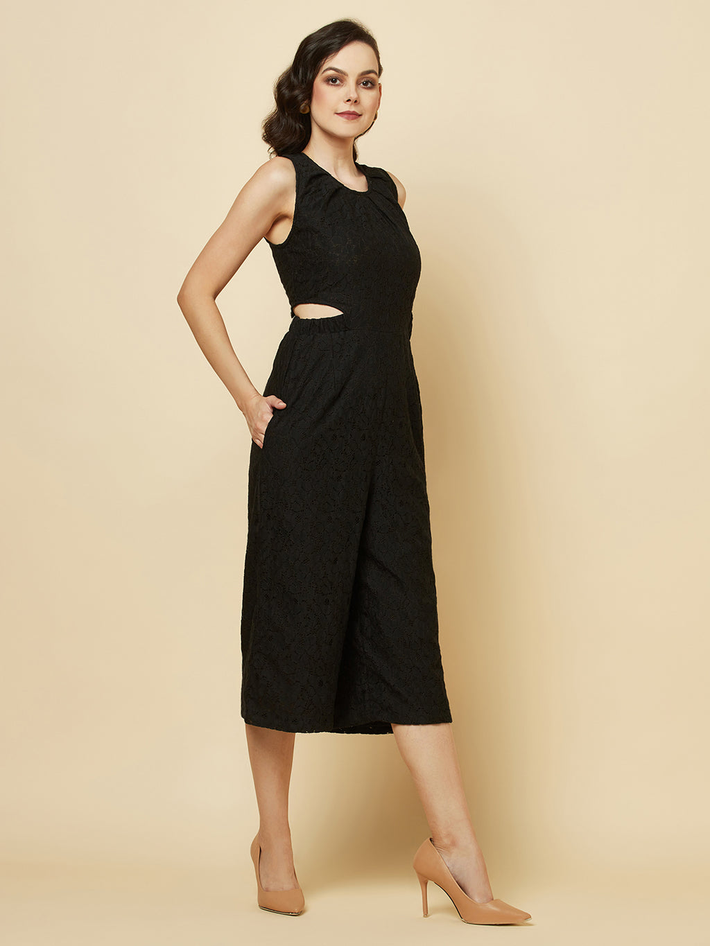 The Black Floral Mesh Side Waist Cut Jumpsuit for Women is a stylish and elegant outfit that features a vibrant black floral pattern and mesh detailing on the sides. This jumpsuit for women is designed to accentuate the waistline with a flattering cut, making it a great choice for any formal occasion or dressy event. It is comfortable to wear and made from high-quality materials, ensuring both style and comfort.