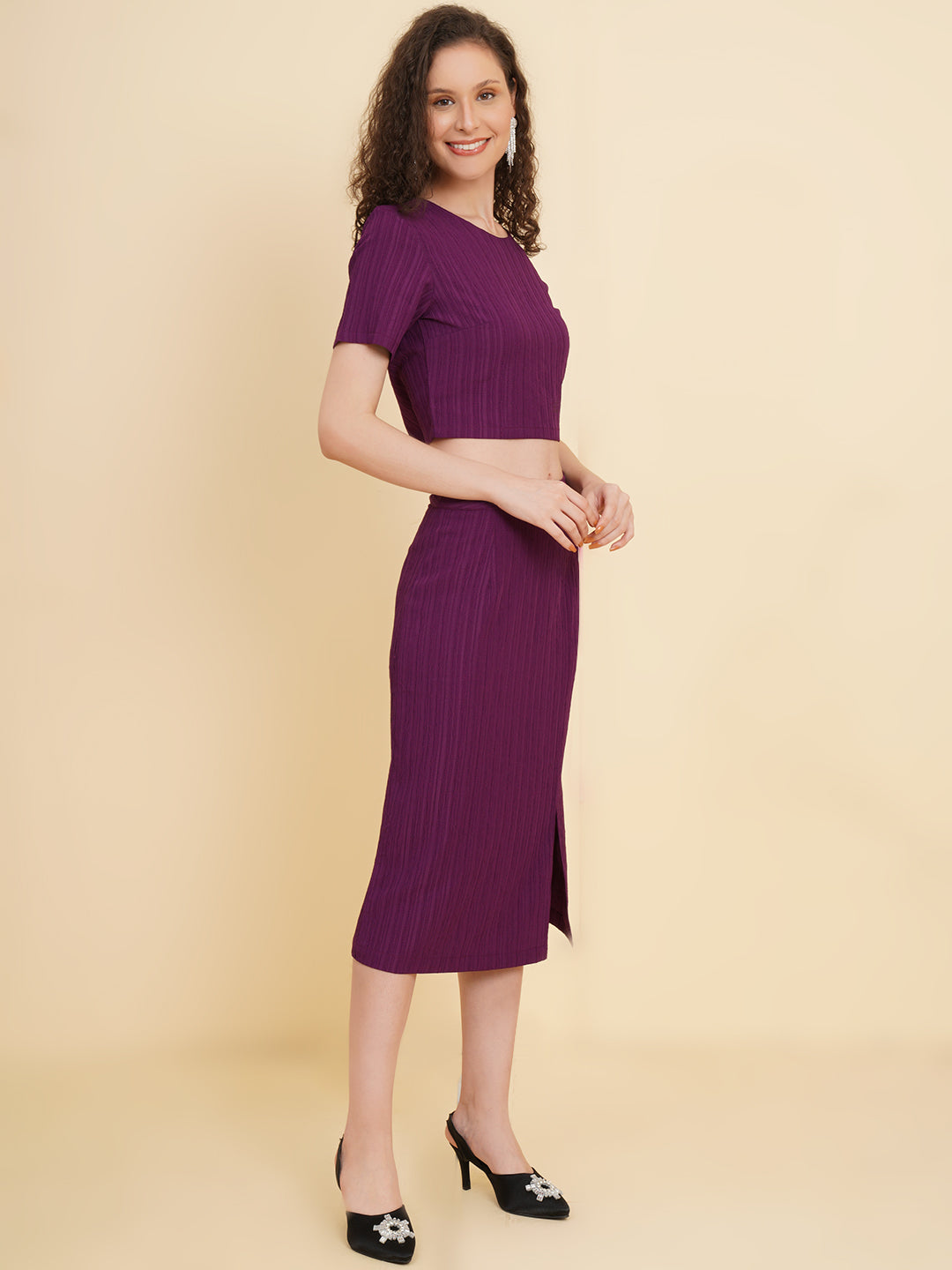 Unleash your inner fashionista with our stunning purple stretchable co-ord set!  Featuring a trendy crop top and a sleek straight skirt.   Colour: Purple Material: Polyester Neck: Round with Keyhole at back Sleeve: Short Top Closure: Button Skirt Closure: Zip