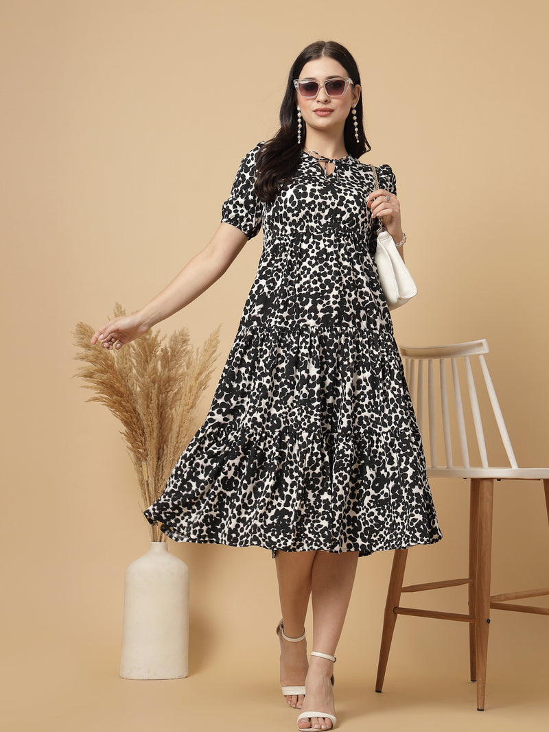 Tiered to perfection, this tier midi dress features a comfortable elasticated waist that creates a flawless fit-and-flare silhouette. Dress it up or down for effortless style.

This elegant tier dress effortlessly defines your shape, creating a feminine silhouette that's perfect for any occasion.