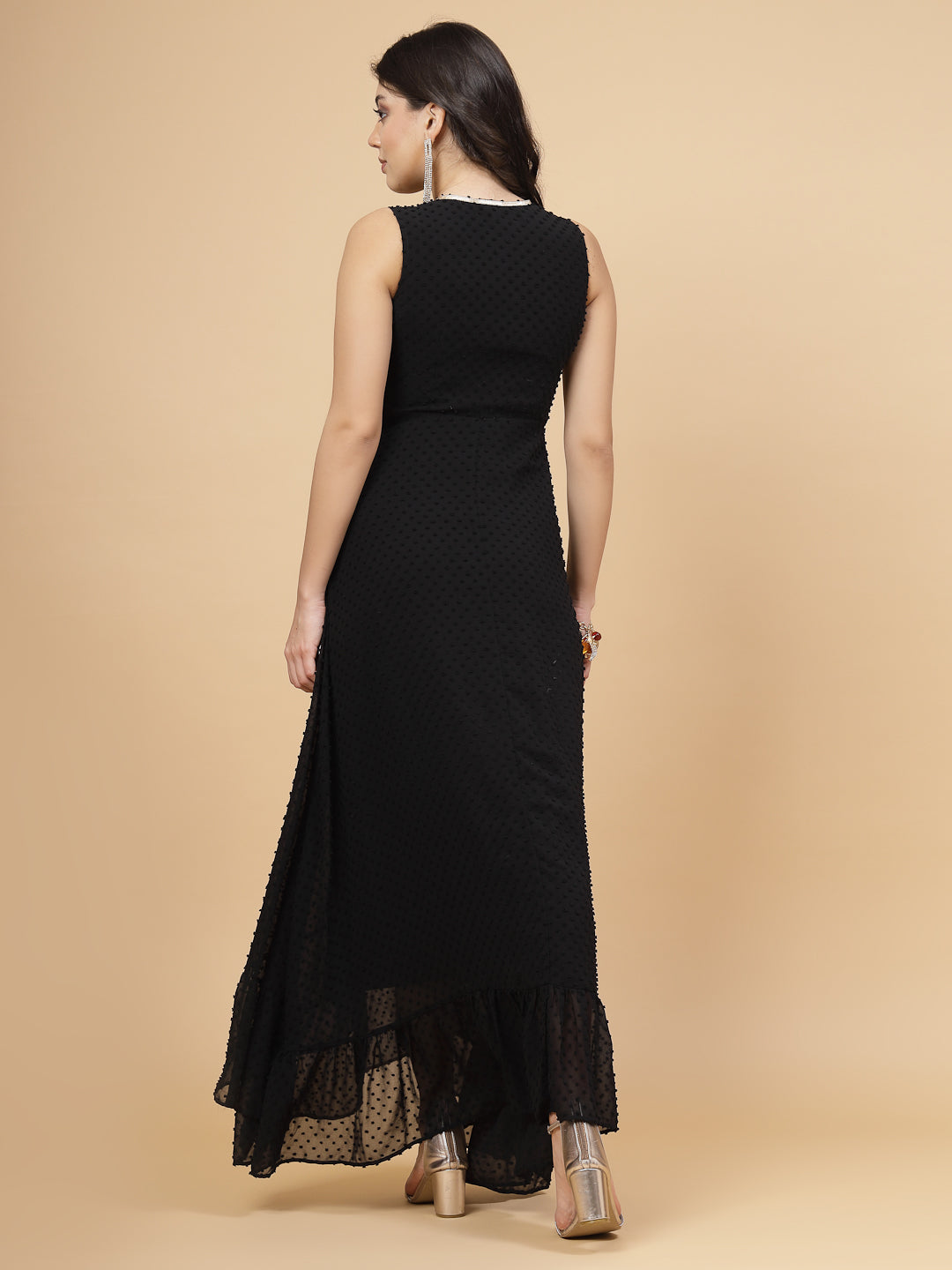High Low Traditional maxi dresses in black color is a trendy and comfortable dress for  women in georgette with Swiss dot texture. Tailored with V-neck and high low pattern. Finished with a zip closure. It comes with a attached lining.
