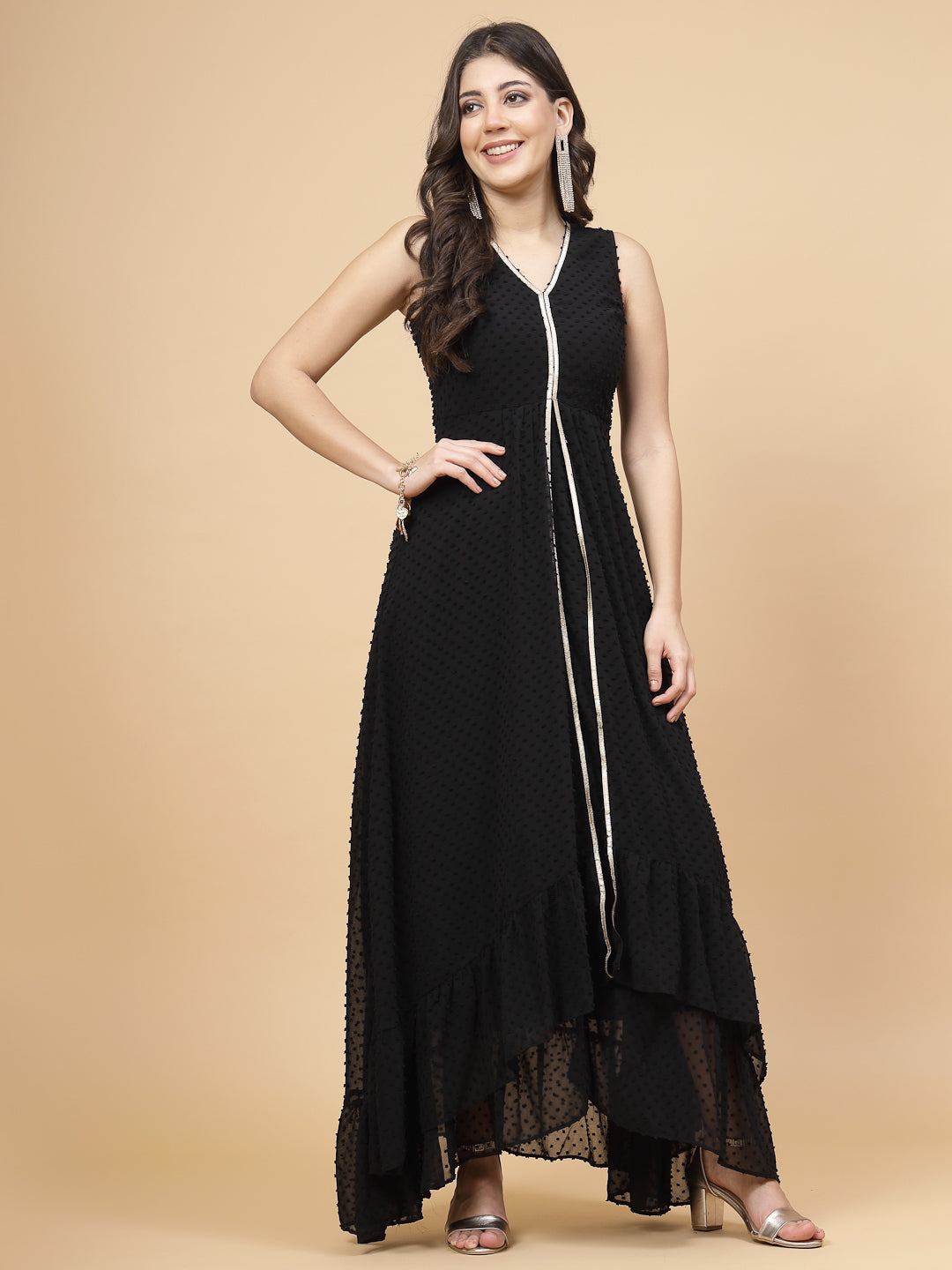 High Low Traditional maxi dresses in black color is a trendy and comfortable dress for  women in georgette with Swiss dot texture. Tailored with V-neck and high low pattern. Finished with a zip closure. It comes with a attached lining.