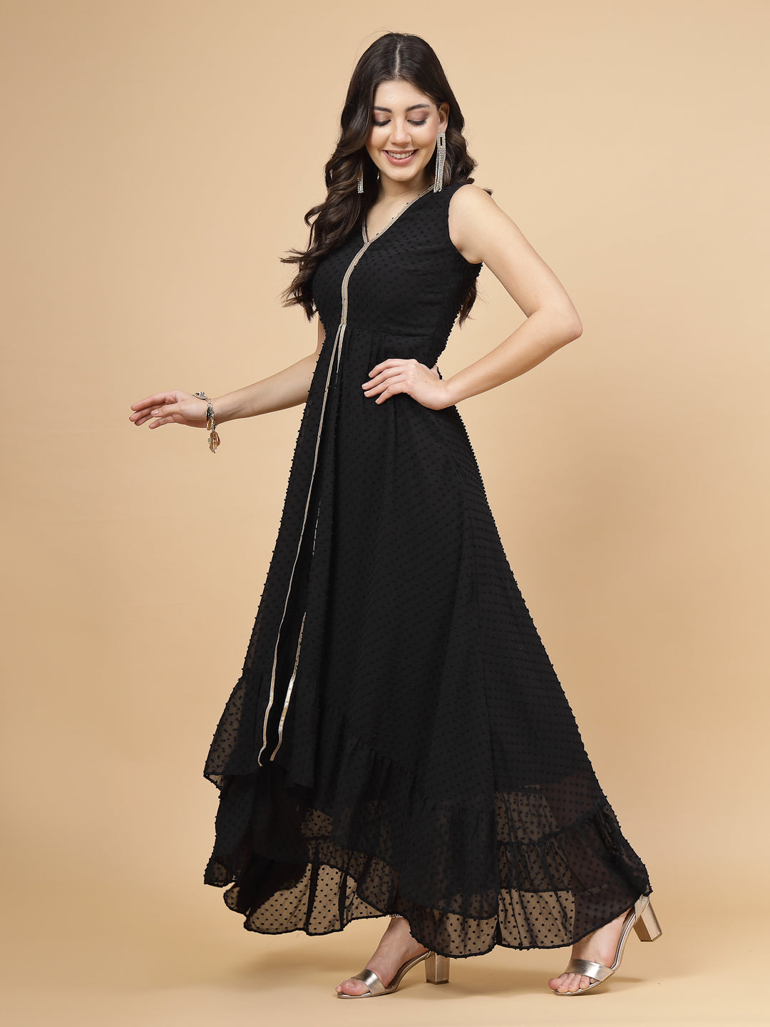 High Low Traditional maxi dresses in black color is a trendy and comfortable dress for  women in georgette with Swiss dot texture. Tailored with V-neck and high low pattern. Finished with a zip closure. It comes with a attached lining.
