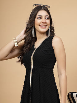 High Low Traditional maxi dresses in black color is a trendy and comfortable dress for&nbsp; women in georgette with Swiss dot texture. Tailored with V-neck and high low pattern. Finished with a zip closure. It comes with a attached lining.