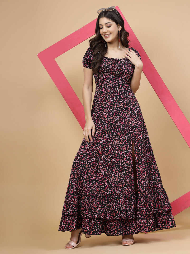 A floor-length casual maxi dress in a vibrant pink color. The dress features ruched bust detailing with a drawstring for a customizable fit. It has elasticated shoulders, creating a comfortable and versatile style. The empire waist accentuates the figure, and a double ruffle adds a touch of flair. A front flare with a slit enhances mobility and style. The dress is secured with a zip closure for easy wear.