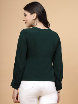 A vibrant green puff sleeve blouse designed for a fashionable look. The blouse features a button closure at the front, allowing for easy wear. With full sleeves, it is a versatile and stylish choice, perfect for pairing with jeans to create a trendy ensemble.