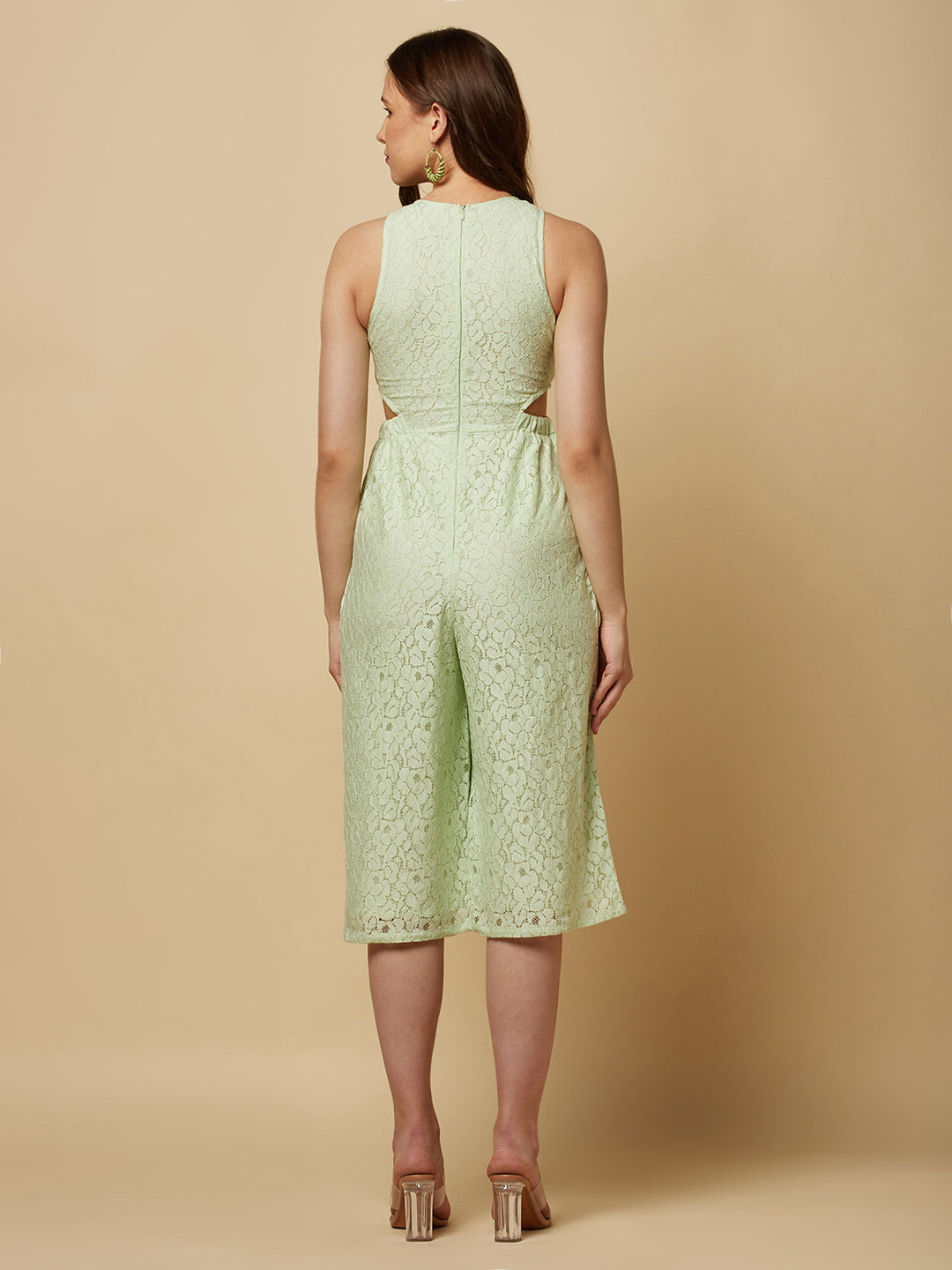 The Green Floral Mesh Side Waist Cut Women Jumpsuit is a stylish and elegant outfit that features a vibrant green floral pattern and mesh detailing on the sides. The jumpsuit is designed to accentuate the waistline with a flattering cut, making it a great choice for any formal occasion or dressy event. It is comfortable to wear and made from high-quality materials, ensuring both style and comfort.