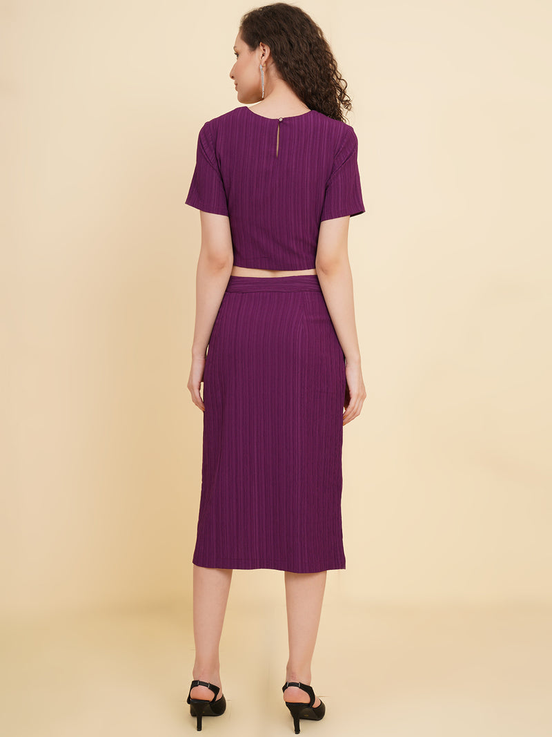 Unleash your inner fashionista with our stunning purple stretchable co-ord set!  Featuring a trendy crop top and a sleek straight skirt.   Colour: Purple Material: Polyester Neck: Round with Keyhole at back Sleeve: Short Top Closure: Button Skirt Closure: Zip