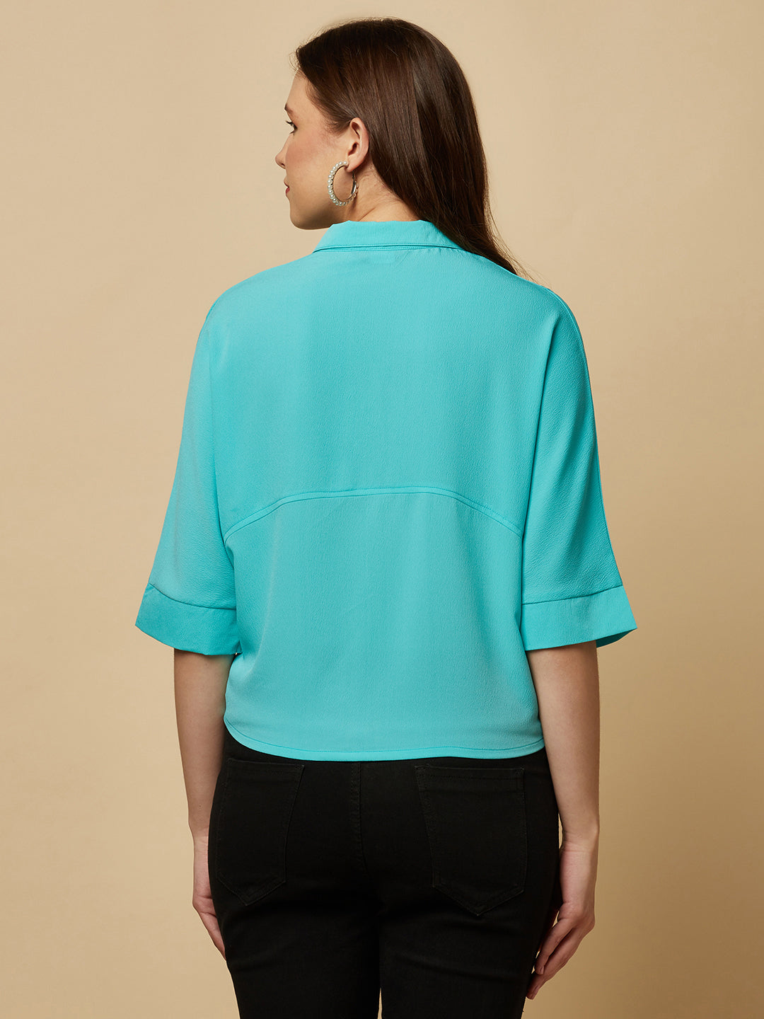 Turquoise Color Over Size Shirt for Women! This vibrant and eye-catching top is the perfect choice for fashion-forward women who want to stand out from the crowd. With its bold turquoise hue and oversized fit, it's the perfect combination of comfort and style. Whether you're dressing up for a night out or keeping it casual for a day out with friends, this shirt is sure to become your new go-to.