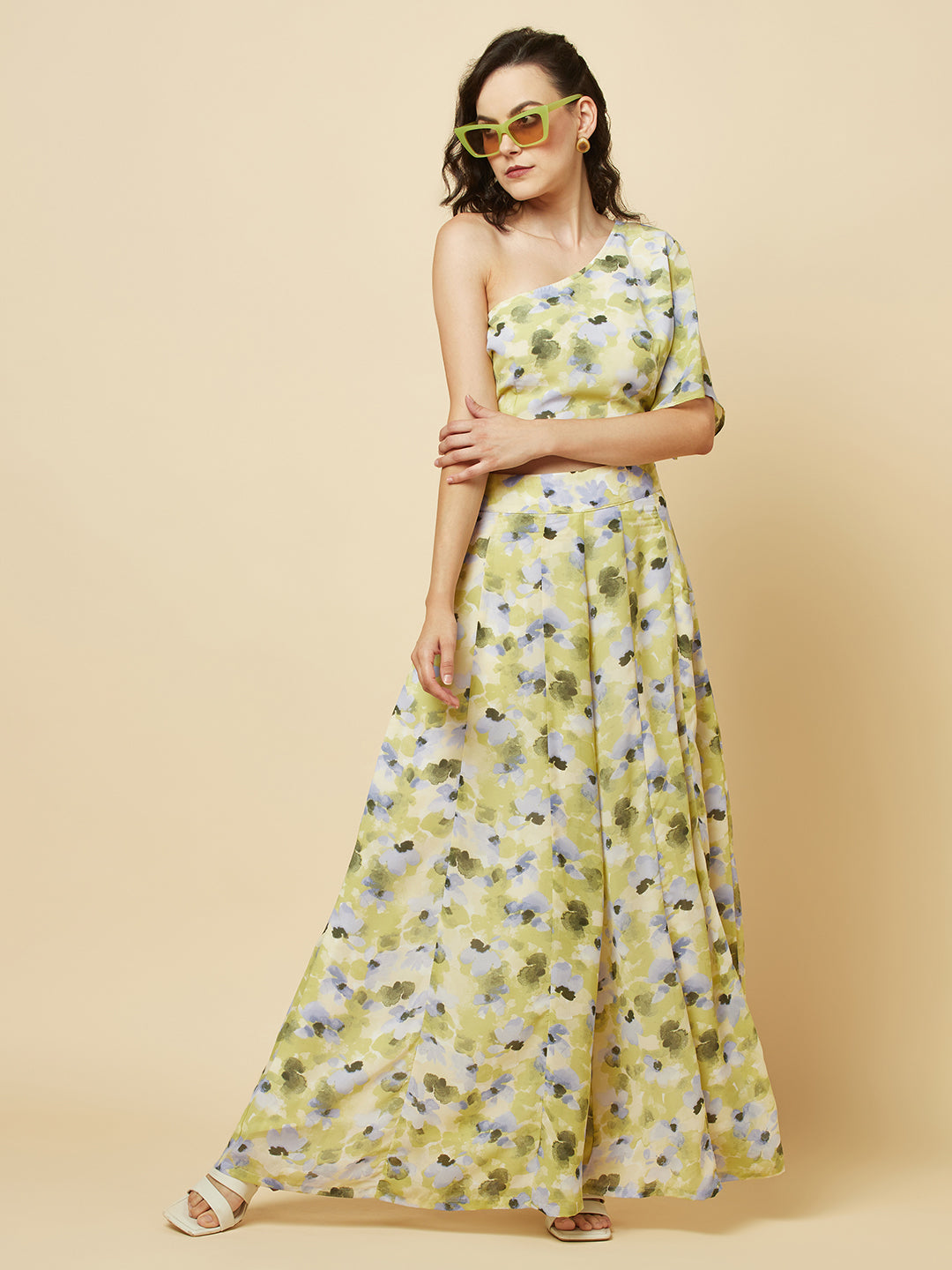 Green floral printed palazzo with one shoulder crop top co-ords for women is a stylish and comfortable outfit choice. The palazzo pants feature a wide-leg cut, providing ease of movement and comfort. The green floral print adds a pop of color and a touch of femininity to the outfit. The one-shoulder crop top is a trendy and flattering choice, showing off the shoulders and adding a touch of elegance to the look. The co-ord set is perfect for a variety of occasions, from casual outings to dressy events. 
