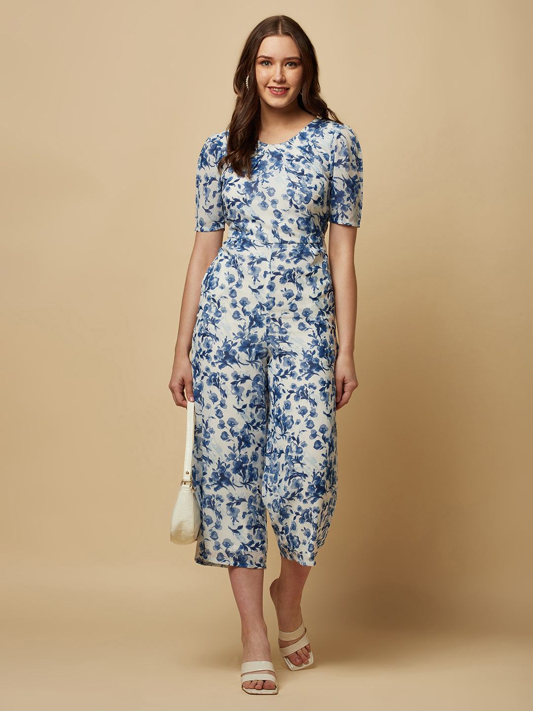 Introducing our stunning Blue Printed Women Jumpsuit With Back Waist Cut and Draw String, the perfect addition to your wardrobe for a stylish and comfortable look.  Crafted from high-quality materials, this jumpsuit is both soft and durable, making it perfect for all-day wear. The back waist cut adds a touch of elegance to the design, while the drawstring ensures a perfect fit that flatters your figure.
