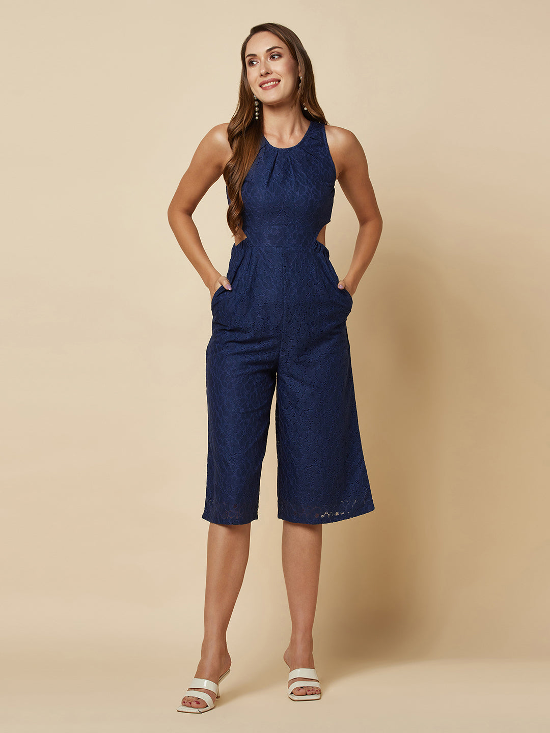 The blue Floral Mesh Side Waist Cut Jumpsuit for Women is a stylish and elegant outfit that features a vibrant blue floral pattern and mesh detailing on the sides. This women jumpsuit is designed to accentuate the waistline with a flattering cut, making it a great choice for any formal occasion or dressy event. This jumpsuit for women is comfortable to wear and made from high-quality materials, ensuring both style and comfort.