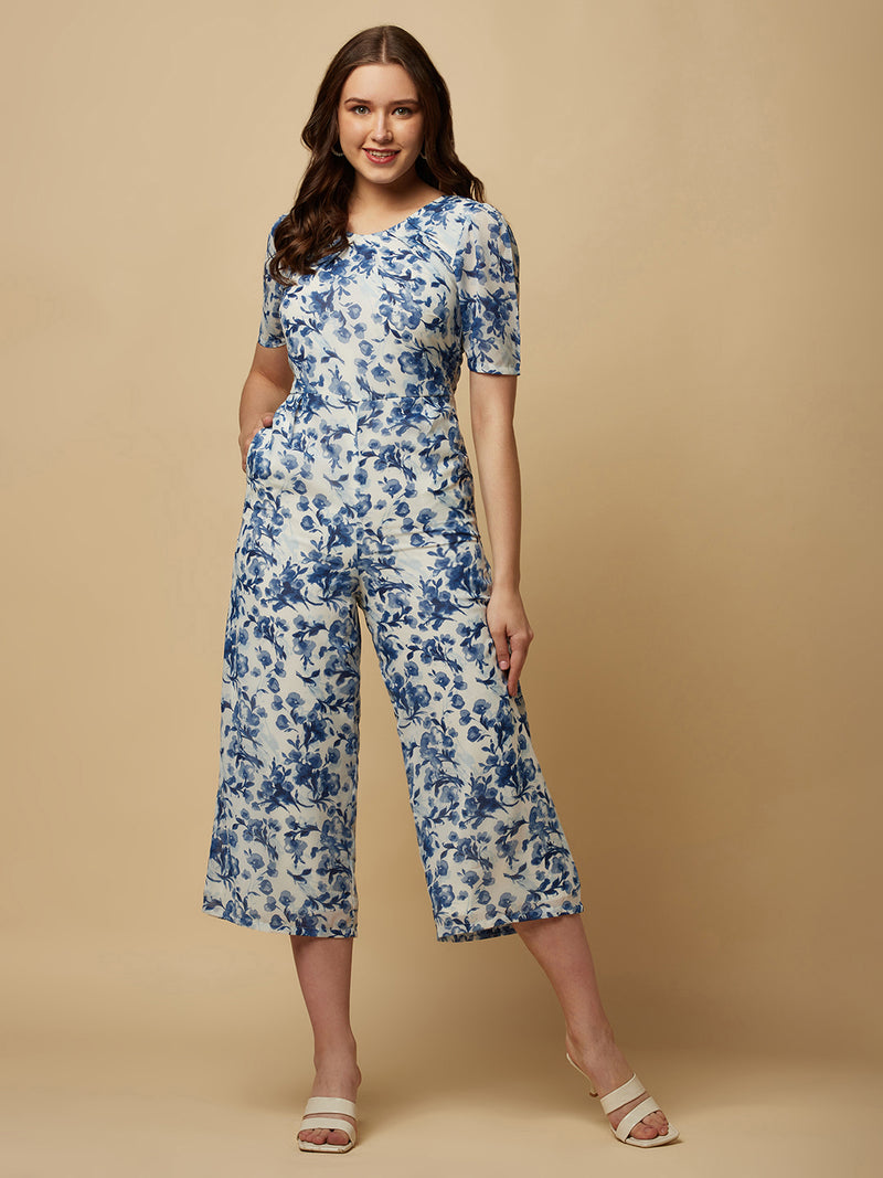 Introducing our stunning Blue Printed Women Jumpsuit With Back Waist Cut and Draw String, the perfect addition to your wardrobe for a stylish and comfortable look.  Crafted from high-quality materials, this jumpsuit is both soft and durable, making it perfect for all-day wear. The back waist cut adds a touch of elegance to the design, while the drawstring ensures a perfect fit that flatters your figure.