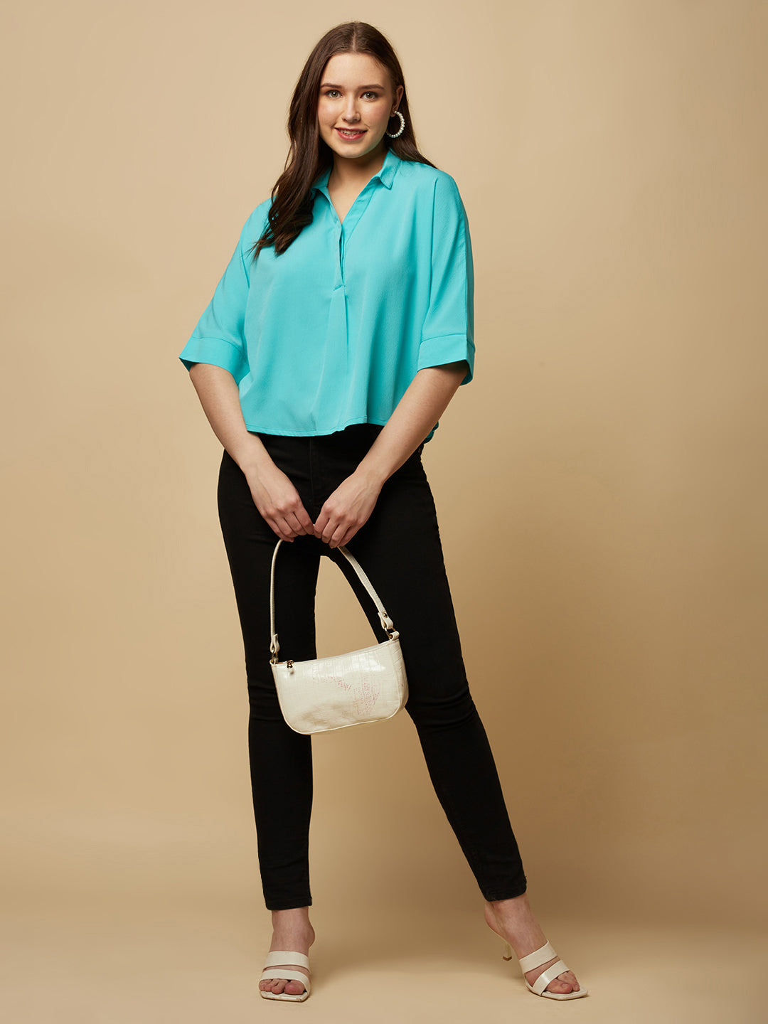 Turquoise Color Over Size Shirt for Women! This vibrant and eye-catching top is the perfect choice for fashion-forward women who want to stand out from the crowd. With its bold turquoise hue and oversized fit, it's the perfect combination of comfort and style. Whether you're dressing up for a night out or keeping it casual for a day out with friends, this shirt is sure to become your new go-to.