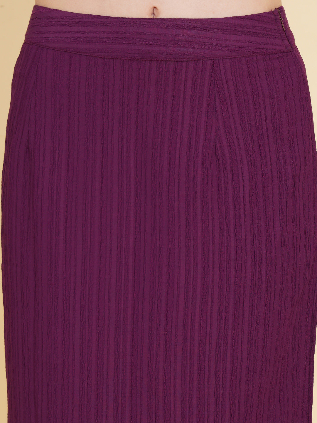 Unleash your inner fashionista with our stunning purple stretchable co-ord set!  Featuring a trendy crop top and a sleek straight skirt.   Colour: Purple Material: Polyester Neck: Round with Keyhole at back Sleeve: Short Top Closure: Button Skirt Closure: Zip