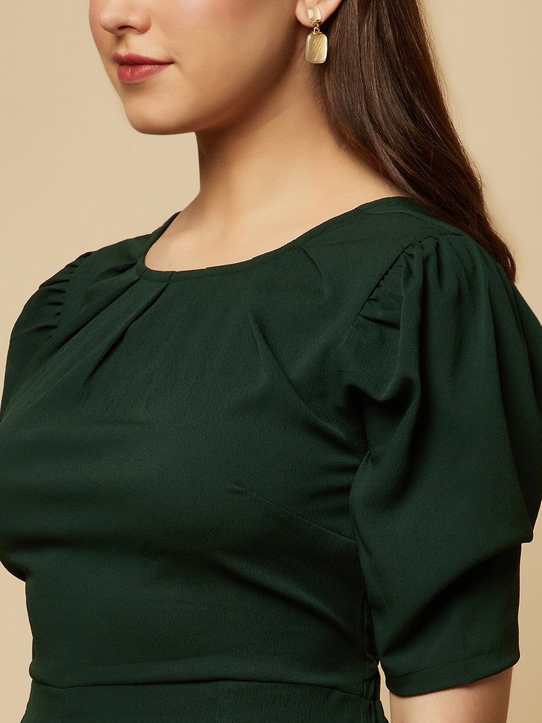 Introducing our stunning Green solid Women Jumpsuit With Back Waist Cut and Draw String, the perfect addition to your wardrobe for a stylish and comfortable look. This jumpsuit features a unique pattern that is sure to turn heads and make you stand out from the crowd.  Crafted from high-quality materials, this jumpsuit is both soft and durable, making it perfect for all-day wear.