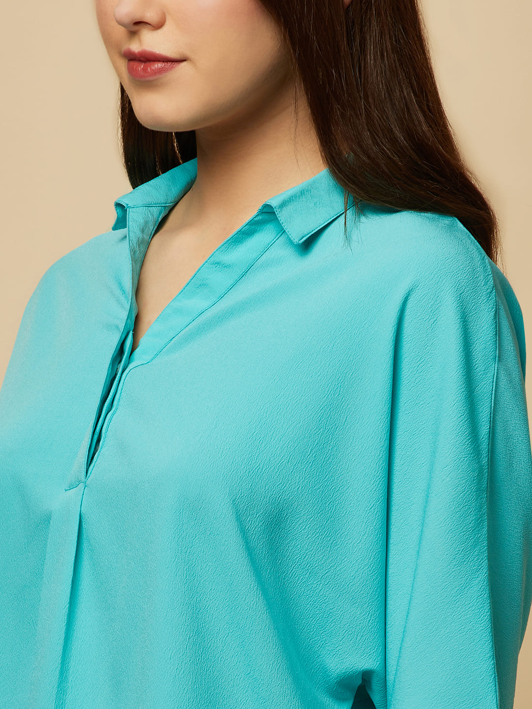 Turquoise Color Over Size Shirt for Women! This vibrant and eye-catching top is the perfect choice for fashion-forward women who want to stand out from the crowd. With its bold turquoise hue and oversized fit, it's the perfect combination of comfort and style. Whether you're dressing up for a night out or keeping it casual for a day out with friends, this shirt is sure to become your new go-to.